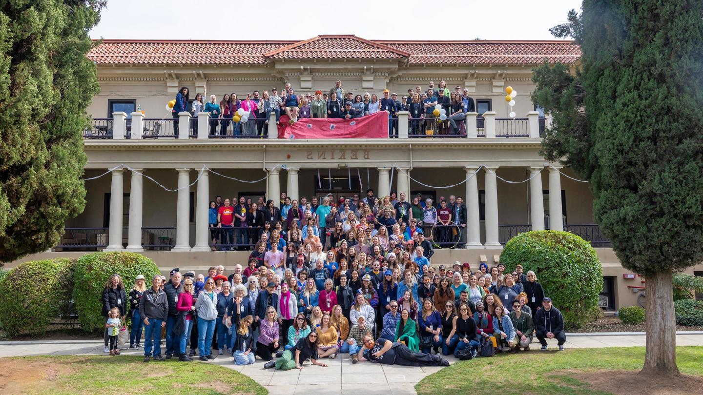 Johnston Students grouped together for photo in front of the Johnston dorm building.